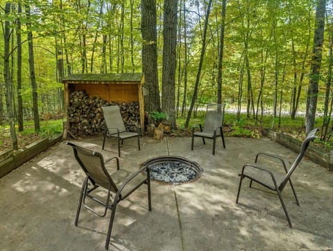 Firepit with plenty of seating and firewood available