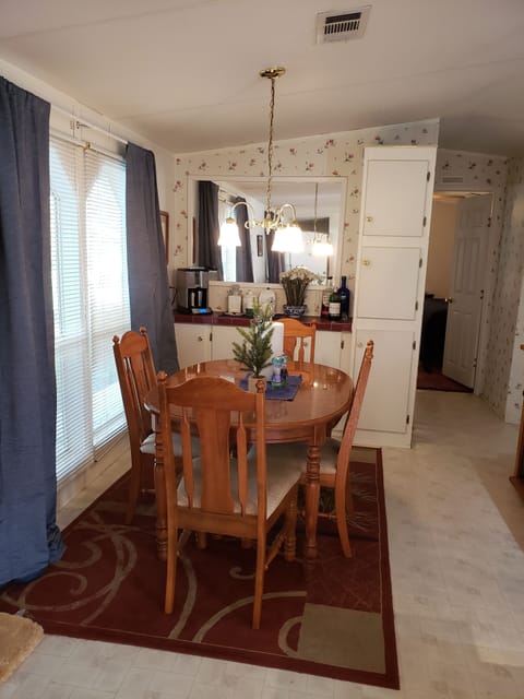 Table sits 6 (with leaf), and 2 at the bar top. Seating for 8.