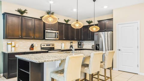 Kitchen island goals! Spacious countertop & stools for breakfast with friends.