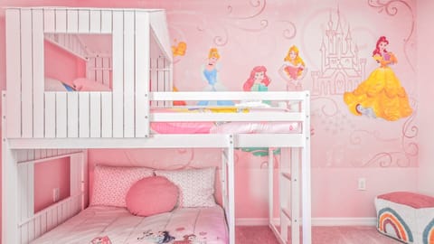 Rose-themed Royal Chamber ideal for three youngsters featuring a distinctive bunk bed arrangement.