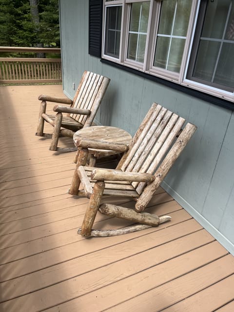 Enjoy a drink on the front porch.  Rocking ADK chairs with table.
