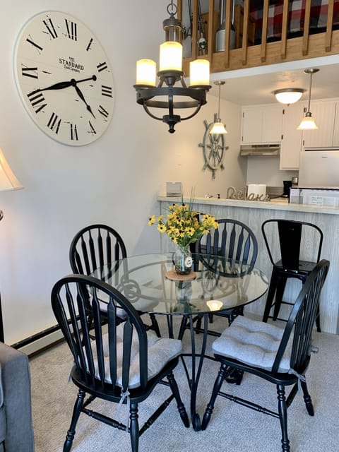 Dining table seasts 4 with additional seating at the counter for 2