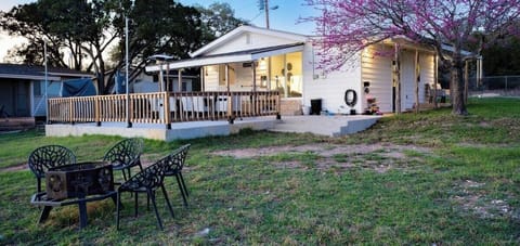 Outdoor firepit with seating for seven. Remember to bring local firewood and check for any burn bans before use.