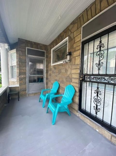 Enclosed front porch with private entrance to bedroom 1 and bedroom two. 