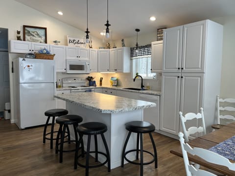 fully stocked kitchen, towels, hot pad, crock pot, blender etc