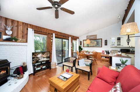 open and comfortable living area with a roku TV & extra sofa bed