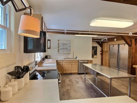 Whip up a memorable meal in the large kitchen with commercial fridge