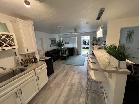 Kitchen Bar (right), Wet Bar (left) and Front Entrance
