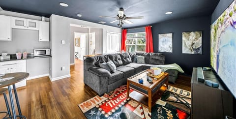 Create memories with the family in this movie room, featuring a bar and 85" TV.