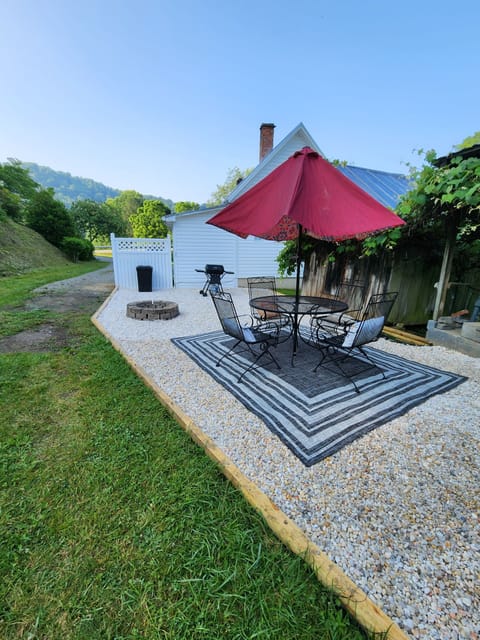 Outdoor patio with gas grill and fire pit