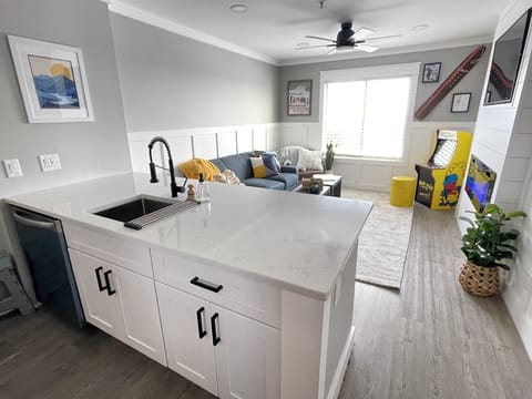Overview of the kitchen peninsula and living room.