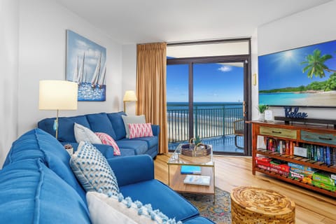 The living room is located at the front of the condo with incredible ocean views