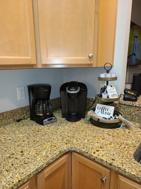 Coffee area with Keurig and regular coffee pot. Kcups and Coffee provided.