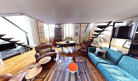 Cosy seared area leading to high vaulted ceiling with lots of natural light.