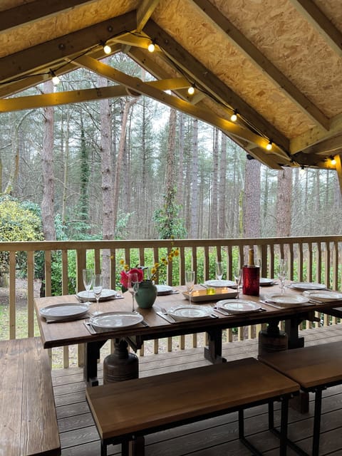 Covered dining with stunning forest views.