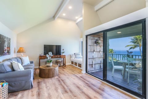 Unwind in the bright and airy living room that opens directly to your private balcony with panoramic ocean views.