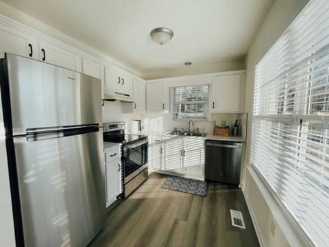 Full kitchen is outfitted with baking supplies for a comfortable stay.