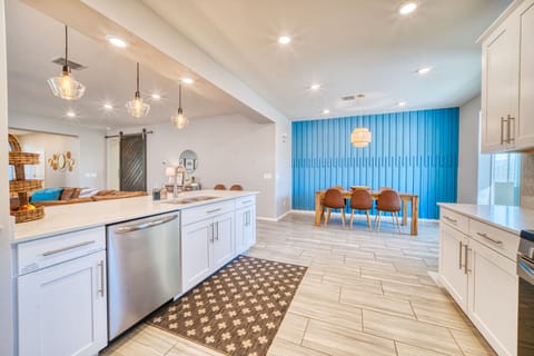 Kitchen looking in to dining area with seating for 8
