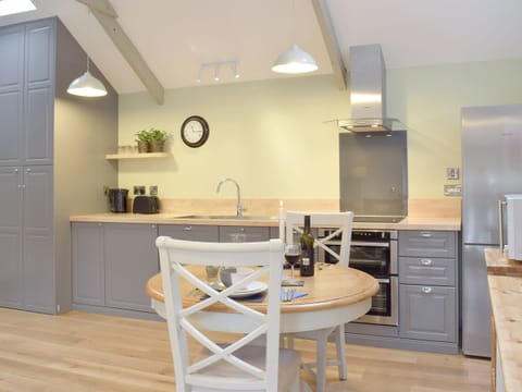 Spacious kitchen area | Honeysuckle Cottage, Valast Hill, near Stackpole