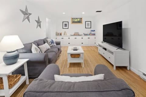 Ground floor family room featuring 65 flat screen smart tv