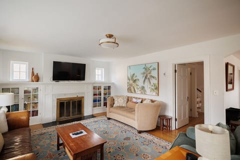 Bright and Sunny Living Room with 2 couches and 2 love seats. Smart TV and plenty of games for all!