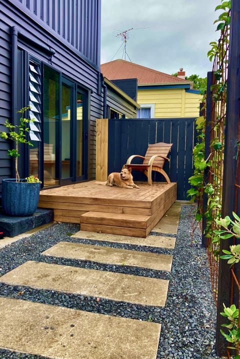 Path to the deck, the key is in the lockbox on the fence, next to the entry.