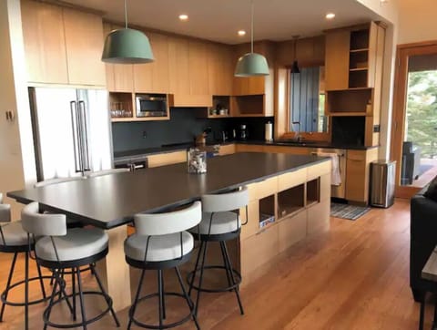 Kitchen with window out to the screen porch.
