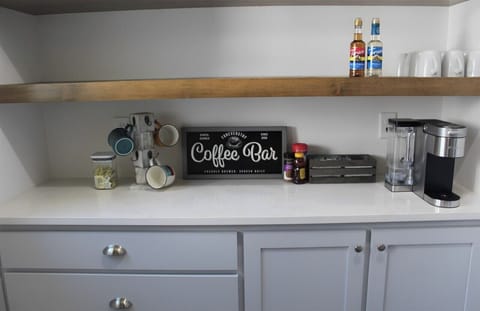 Wake up to the lake with ease. We’ve stocked the coffee bar with a traditional brewer and all the essentials—grounds, creamers, and sweeteners—for those slow, lingering mornings.