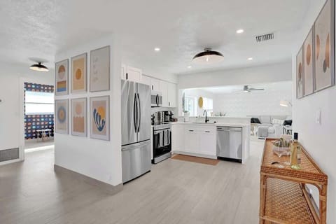 The kitchen overlooks the living room. Very convenient layout for families and friends to spread out while still enjoying each other company and making lifelong memories.