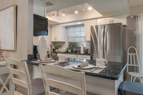 Breakfast bar seating. LG stainless steal refrigerator.