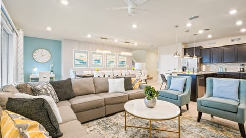 Spacious living room area with cozy sofa, perfect for family reunion