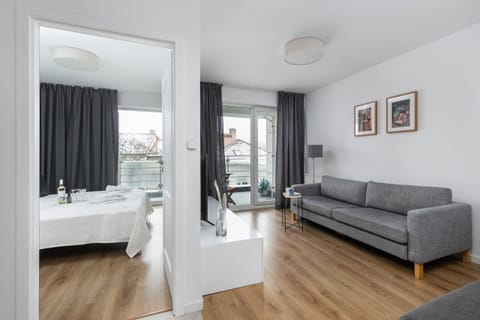 A cozy bedroom and living area.

