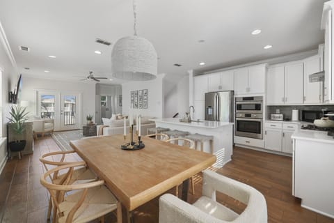 Second-floor open concept living, dining, and kitchen area.  A bright gathering space perfect for relaxing with your group.