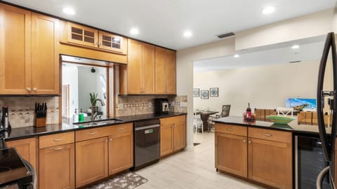 Savor every bite and sip — a modern kitchen complete with a wine fridge for your convenience.