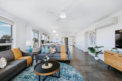 Spilling into the outdoor deck, the open plan living room allows for the perfect host. 
