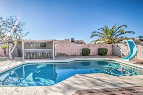 Pool area with bar and TV.