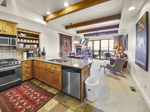 Relax in this mountain-modern open-concept retreat. Featuring a fully equipped kitchen with granite countertops, warm wood accents, and a cozy stone fireplace for the ultimate Park City escape.