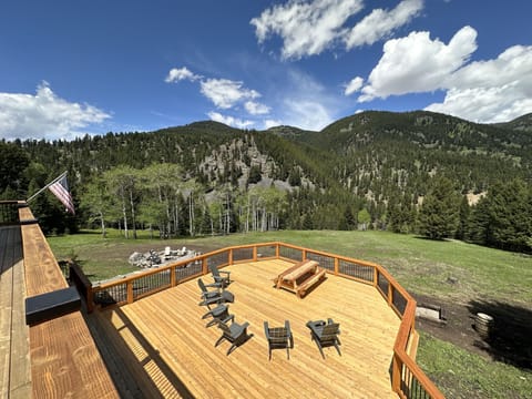 New large back deck recently added with view overlooking the Gallatin River
