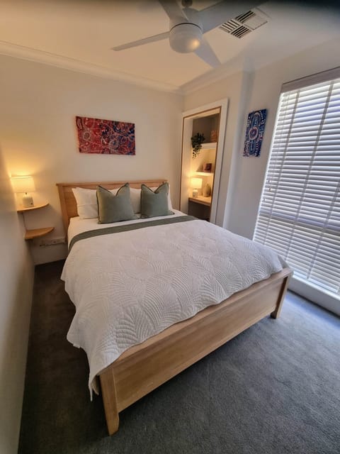 Beautiful Queen bedroom with air-conditioning/ heating and reading lamps. Sockets beside the b