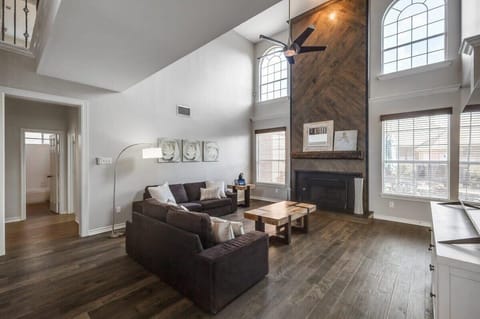 With vaulted high ceilings and grand windows, this living room offers an airy, sophisticated atmosphere where you can relax and enjoy yourselves.