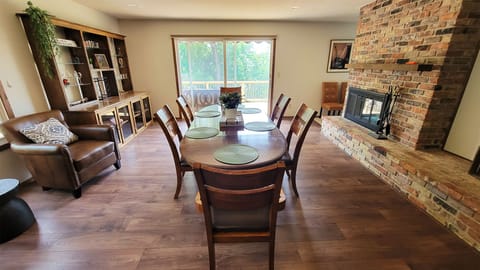 Great open area dining room and kitchen with mounted TV and Fireplace.