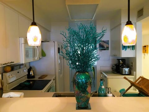 Standing with your back to the dining table, looking at the kitchen.