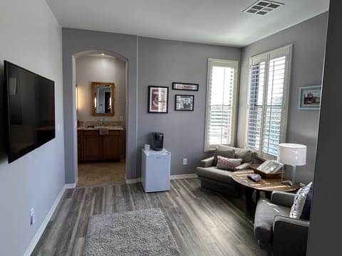 Master suite sitting area with Keurig and mini fridge