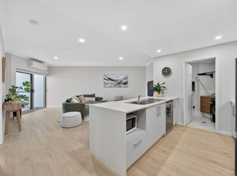 Well equipped kitchen and modern spacious living room. 
