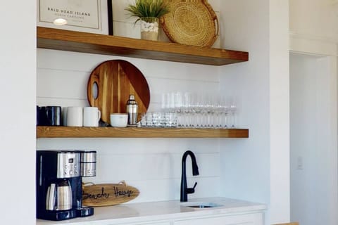 There is a large wet bar and coffee bar available