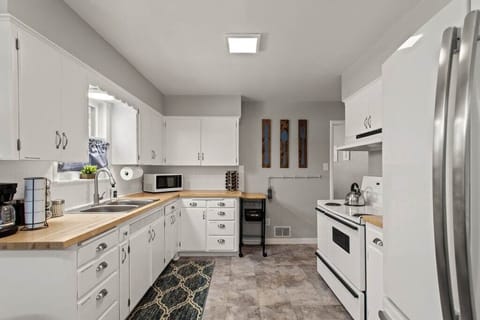 Step into our bright and fully stocked kitchen. With all the essentials at your fingertips, cooking is a breeze.