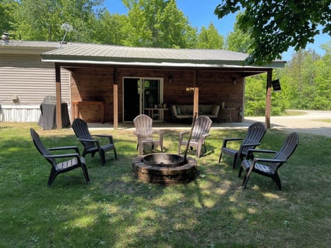 Fire pit and chairs in back yard off the patio. Hammocks available for use also.
