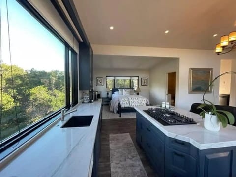 Queen size bed with luxurious bedding and beautiful views.