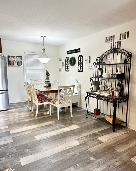 Kitchen table and fully stocked Coffee and tea bar. 