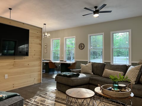 Living Area - 75" smart TV with (2) "L" sectionals and bar to seat 9 people